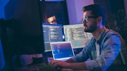 Engineer working at laptop. Engineer working at laptop.