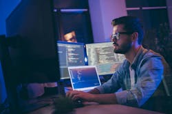 Engineer working at laptop. Engineer working at laptop.