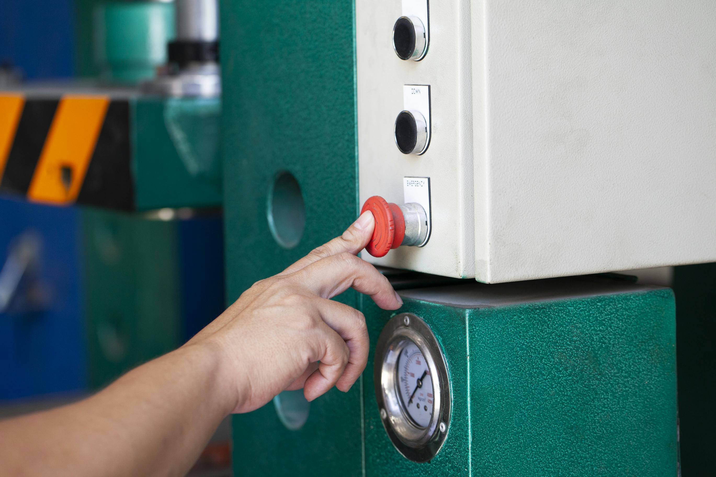 Engineer setting up a testing machine.