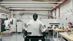 Humanoid robot on factory floor Humanoid robot on factory floor