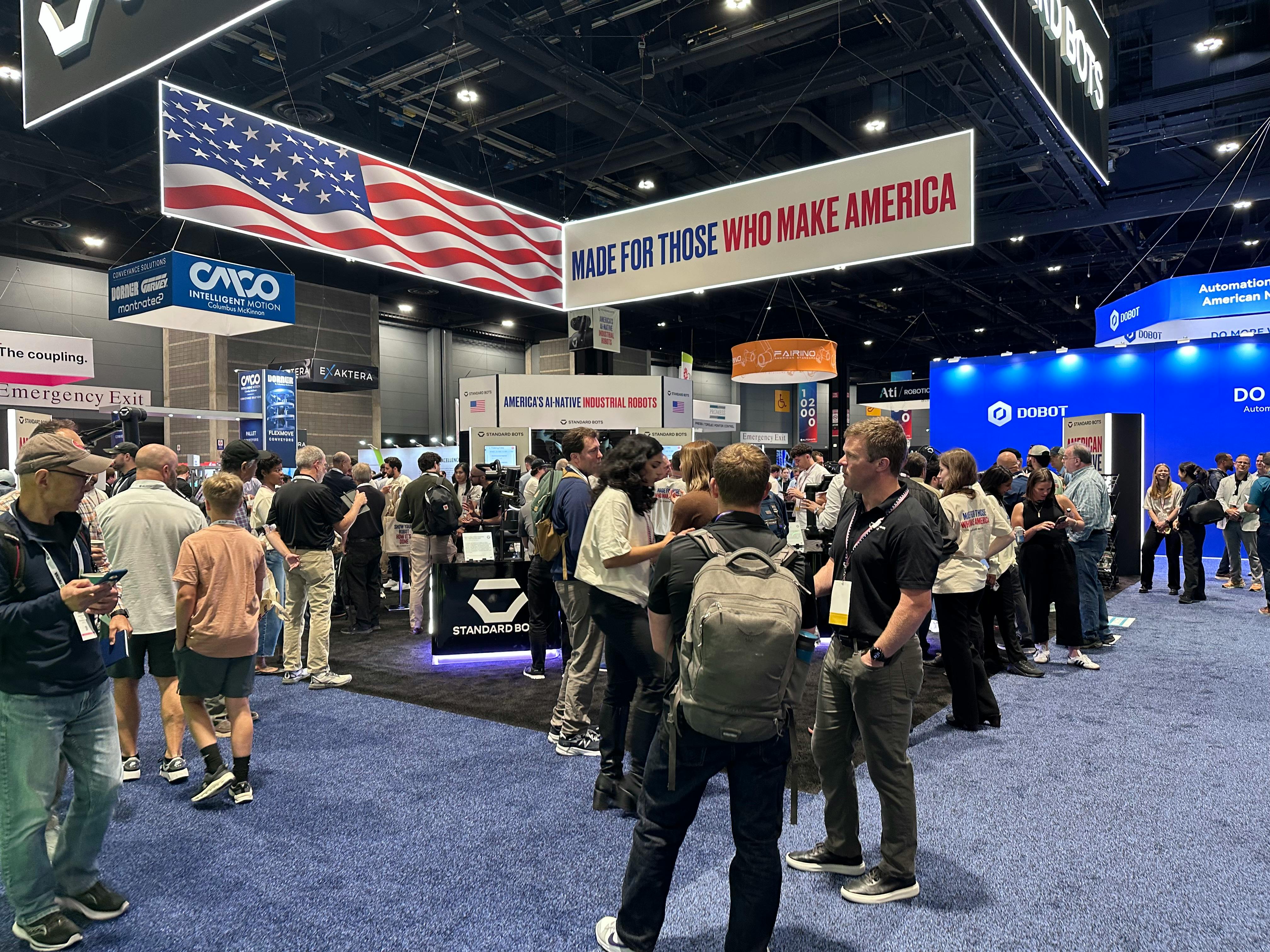 Visitors at the Standard Bots booth