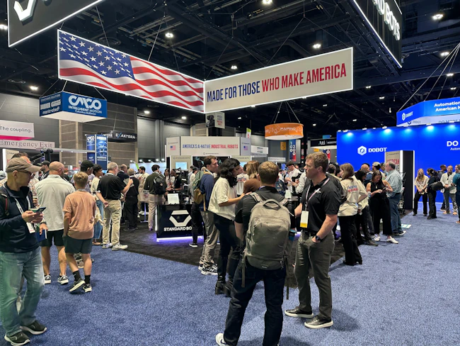 Visitors at the Standard Bots booth