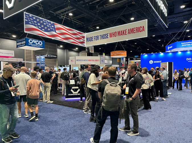 Visitors at the Standard Bots booth