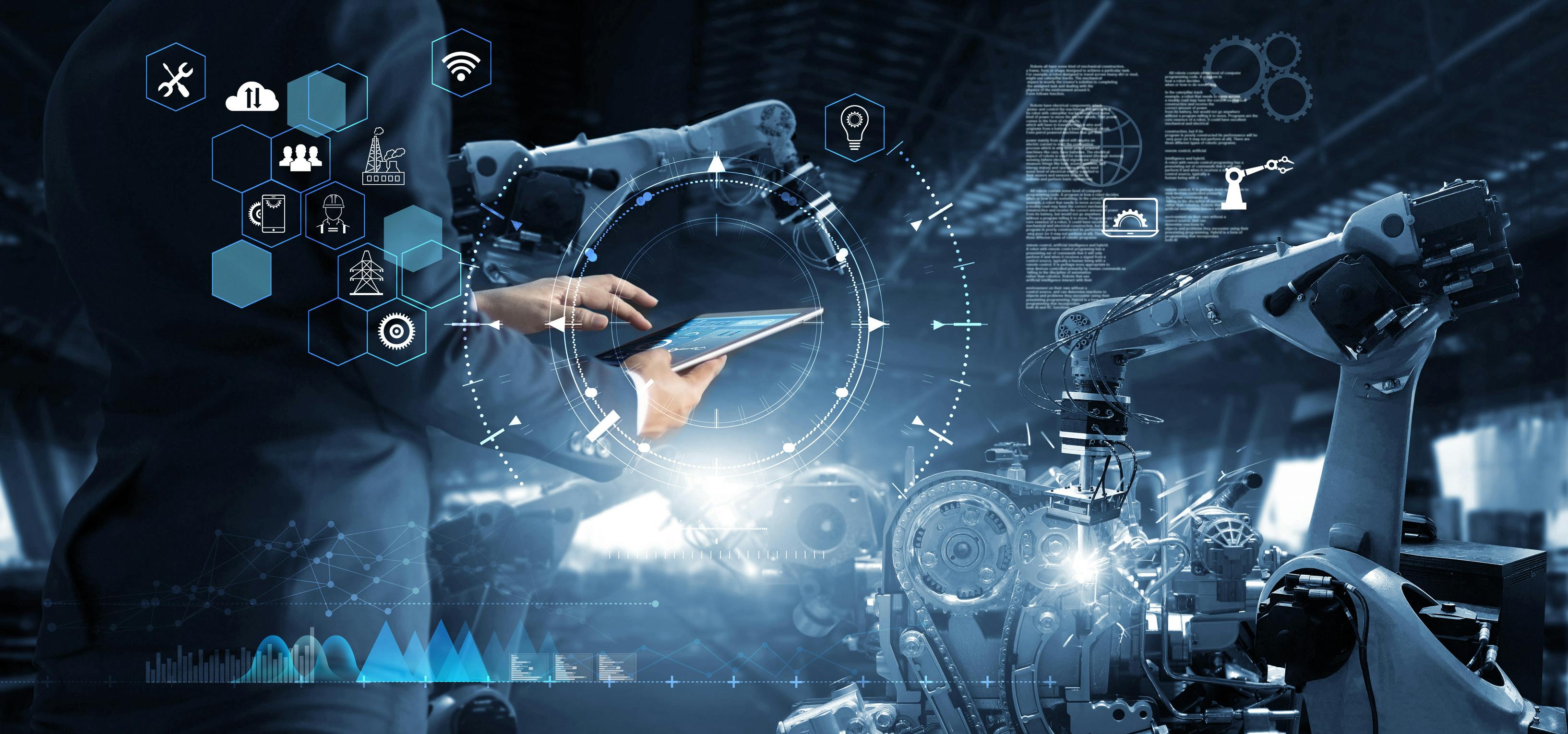 Engineer controlling robotic arm via a tablet