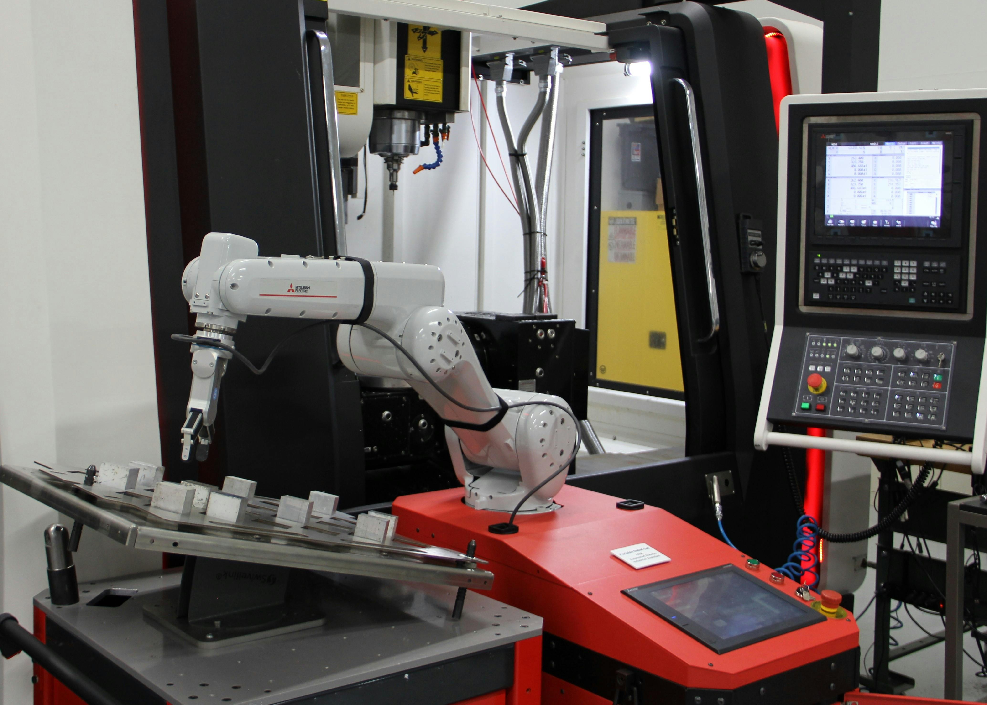 Machine tending arm, extended