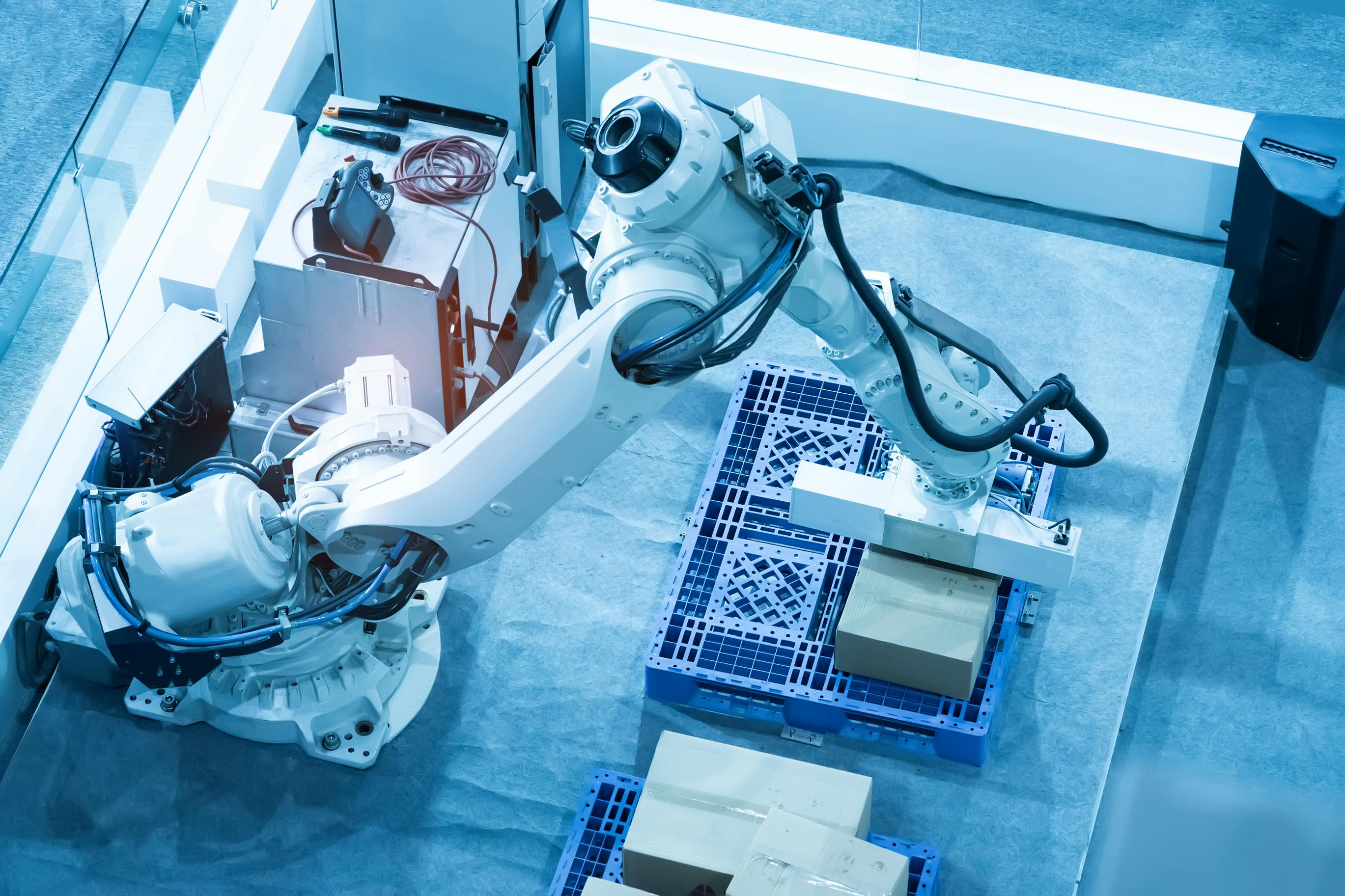 Robotic arm on plant floor